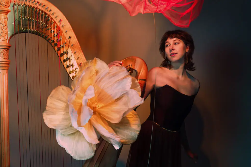 Hilda Kunnola Professional Harpist playing a concert harp in a professional studio setting – elegant and timeless